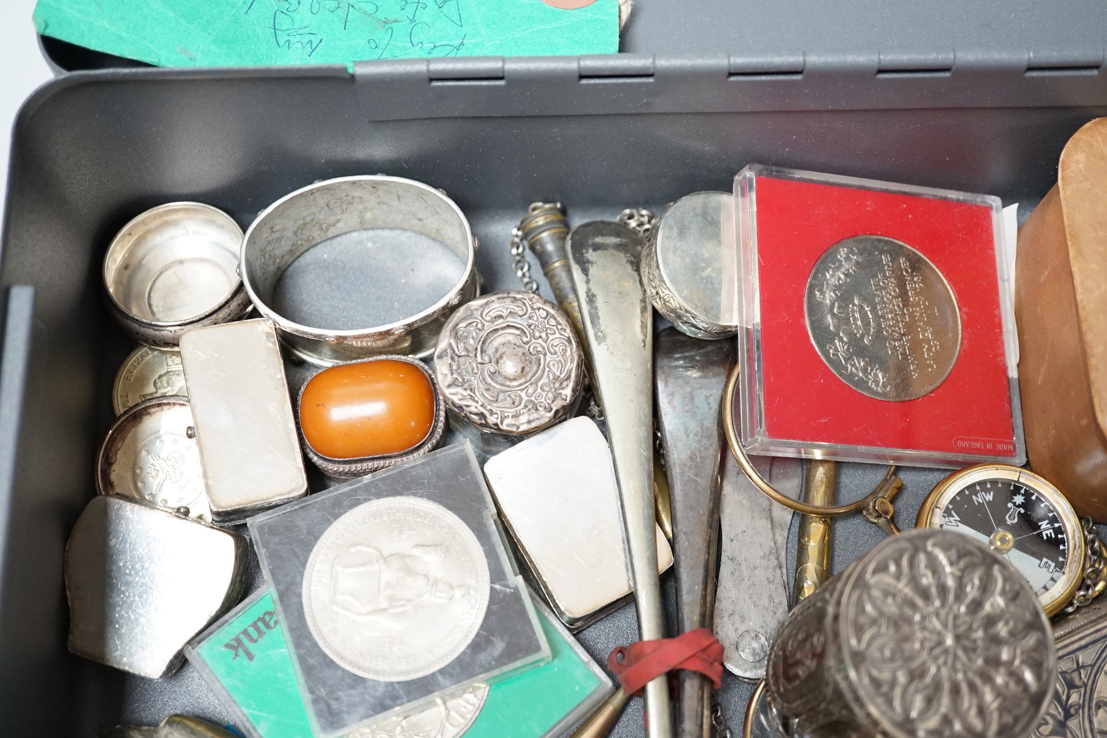 A collection of silver and white metal pill boxes, niello purse, lorgnette and assorted collectables